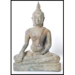 A 19th century Oriental Chinese bronze Buddha modelled in the lotus position raised on a pedestal