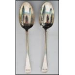 A pair of silver hallmarked table / serving spoons by Josiah Williams & Co (George Maudsley