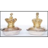 A pair of silver hallmarked lidded table salts, the top surmounted with a gilt crown under which