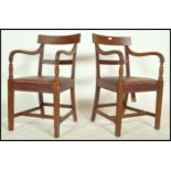 A pair of Regency mahogany bar back carver armchair each raised on reeded squared legs with