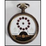 A vintage early 20th century Ancre pocket watch having an enamel face with amethyst backed