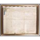 A framed and glazed early 18th century Georgian ( George III ) indenture dated to 1734, retaining