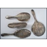 A group of silver hallmarked brushes and mirrors to include engine turned pair. Please see images.