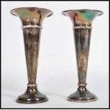 A pair of silver hallmarked candlestick vases by Edward Barnard & Sons Ltd, Birmingham 1944.