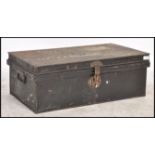 A 19th century ebonised military tin trunk with hinged top bearing notation for Captain Sheppard.