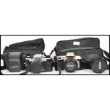 A Nikon F60 camera in carry case with two lenses a 35-70mm and 70-210mm along with a Voigtlander VSL
