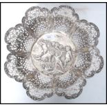 A large 19th century German silver centrepiece bowl having a pierced serpentine edge with scrolls