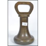 A large antique Avery Ltd bronze 10 kilogram weight of bell / pawn form. The weight stamped Avery No