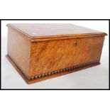 A 19th century Victorian birds eye maple box being cross banded and having ebony inlay. The hinged