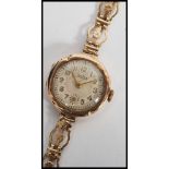 A 20th century ladies 9ct gold cased bracelet watch by Zentra, having quartz movement set to a 9ct