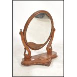 A Victorian mahogany toilet swing dressing mirror