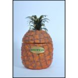 A retro Britvic pineapple shaped ice bucket having the original liner to centre. Measure: 28cms