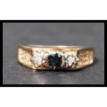 A vintage hallmarked 9ct gold sapphire and diamond three stone ring. Hallmarked for Birmingham