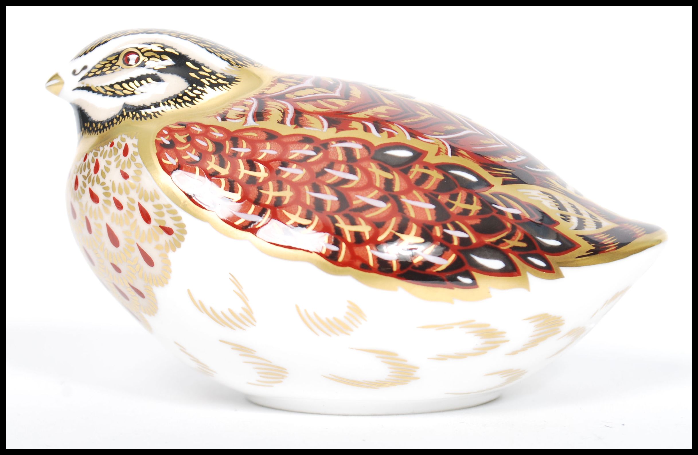 A Royal Crown Derby Grouse paperweight, with red stamp to underside, gold stopper, 6.5cm high
