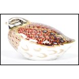 A Royal Crown Derby Grouse paperweight, with red stamp to underside, gold stopper, 6.5cm high