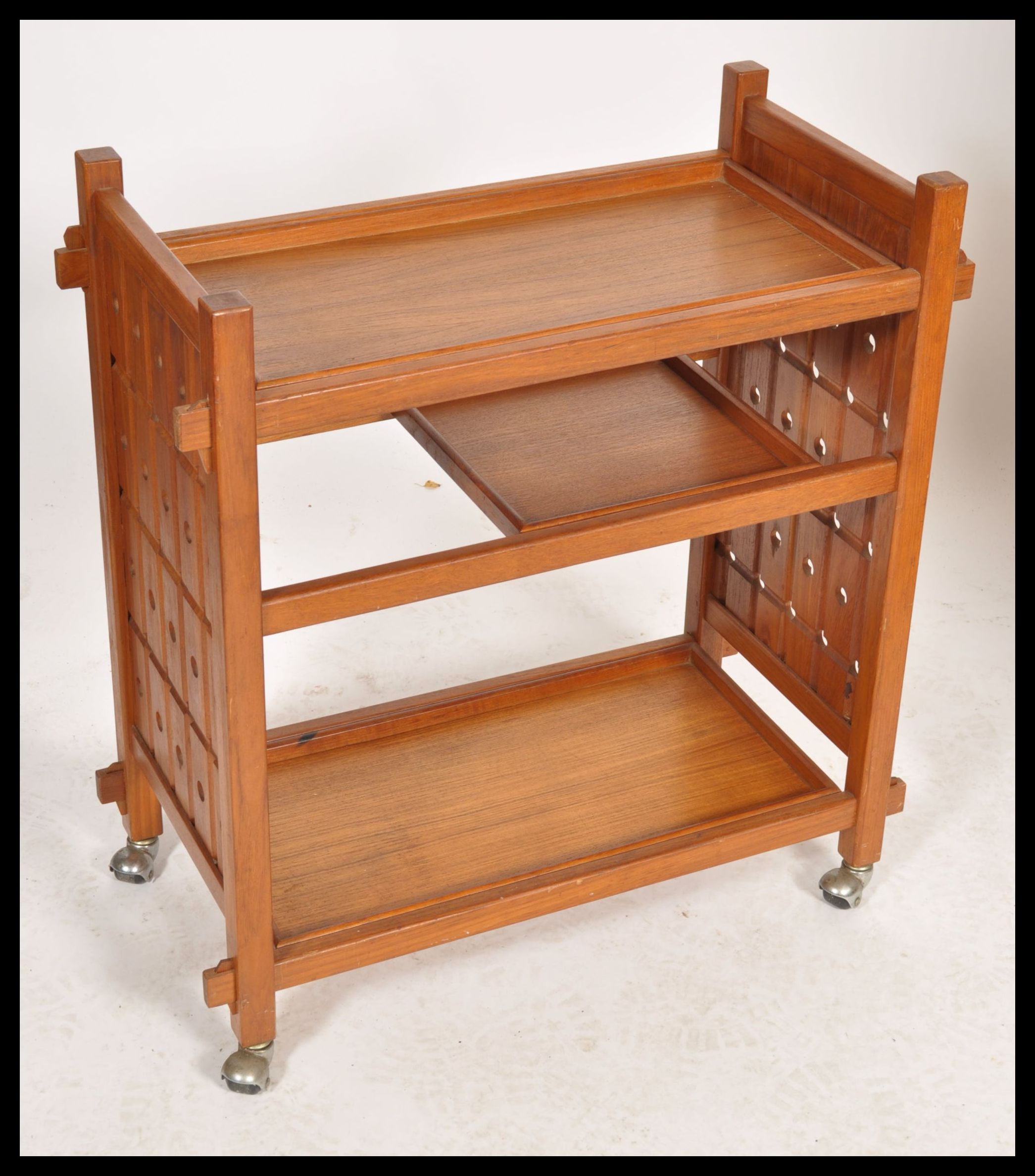 A vintage mid 20th century retro danish influence teak trolley with sliding removable trays raised - Image 2 of 5