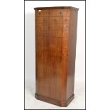 A vintage 1930s Art Deco oak bachelors single wardrobe, having geometric and stud finish to the