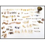 A large collection of vintage 20th century cuff links, buttons , tie clips etc. Many pairs and