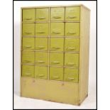 A large mid century Industrial metal 20 drawer filing cabinet. Of heavy upright pedestal form having