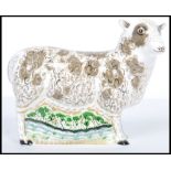 A Royal Crown Derby paperweight of a Jacob Sheep, with gold stopper, red stamp to base and dating to