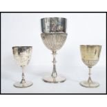 A group of three silver plated 19th century Victorian goblet trophies to include Trinity College