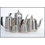 A vintage retro mid 20th century space age steel five person tea service.. Each piece having a