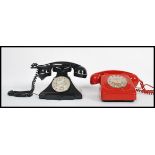 A collection of 2 vintage retro 20th century industrial ring dial telephones in red and black