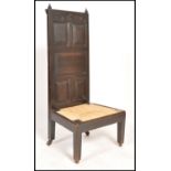 A 19th century gothic pugin manner prayer chair - prie dieu having sqaured legs with rattan weave