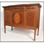 A good early 20th century French Louis XV mahogany and marquetry inlaid breakfront sideboard. Raised