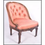 A 19th century Victorian button back bedroom armchair. Of walnut construction with fabulous reeded