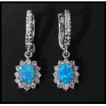 A pair of 925 silver CZ and opal drop earrings having latch backs. Marked 925.