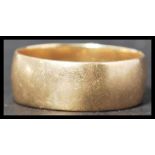 A vintage 20th century hallmarked 9ct gold band ring of simple usual form. Total weight 6.1g
