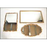 A 20th century large gilt mirror of contemporary form together with 2 further gilded 20th century