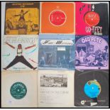 A collection of 7" 45rpm vinyl singles dating from the 70s featuring many artists to include