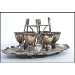 A silver plated six person egg codler breakfast set having a scalloped stand tray.