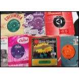 Vinyl Records - A collection of 45rpm 7" vinyl singles featuring various artists to include Adam and
