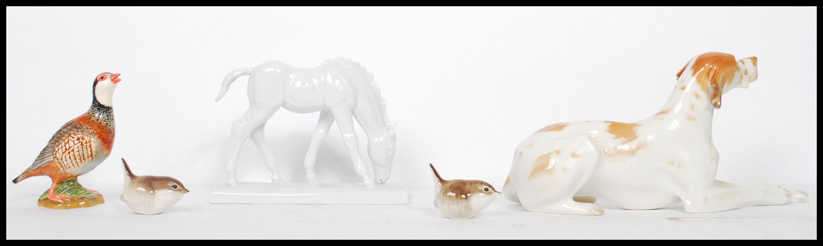 A collection of ceramic figurines to include a pair of Lomonosov / USSR Wrens, a large hound and a - Image 4 of 9