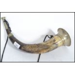 An Ancient Order of Foresters Hunting Horn, with brass mounts, set with a brass AOF badge, with