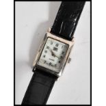 A vintage 20th century silver cased art deco wrist watch.The case of square form with silvered dial.