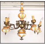 A 20th century Continental five branch brass / ormolu and ceramic light / chandelier light