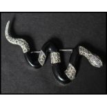 A 925 silver figural brooch in the form of  a snake set with marcasite having a roller clip clasp.