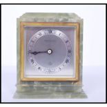 A vintage mid century retro green onyx Elliott mantel clock with silvered dial marked also for WM