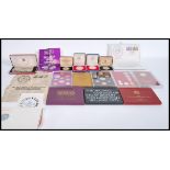 A collection of vintage Royal mint coins to include two sterling silver 1977 crowns in