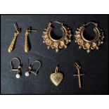 A group of 9ct gold earrings and pendants to include a fancy loop pair, an engraved drop pair, pearl