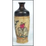 A 19th century Oriental Chinese horn perfume bottle having character marks depicting scenes of a