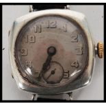 A vintage early 20th century Rolex 1917 trench military interest watch having a silvered dial Arabic
