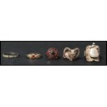 A group of vintage rings to include a large silver harvest buckle ring, a silver rams head ring, a