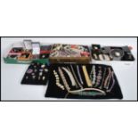 A collection of vintage silver and other costume jewellery to include a tin of various costume and