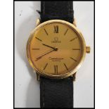 A vintage 20th century Omega Constellation swiss made wrist watch. The gilt dial having baton and
