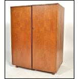 A Vintage mid century Danish influence teak wood mid century metamorphic cabinet desk having